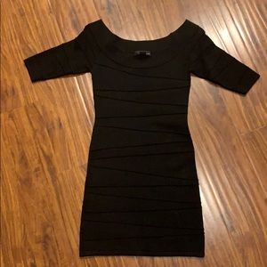 Fitted black mini dress in excellent condition!